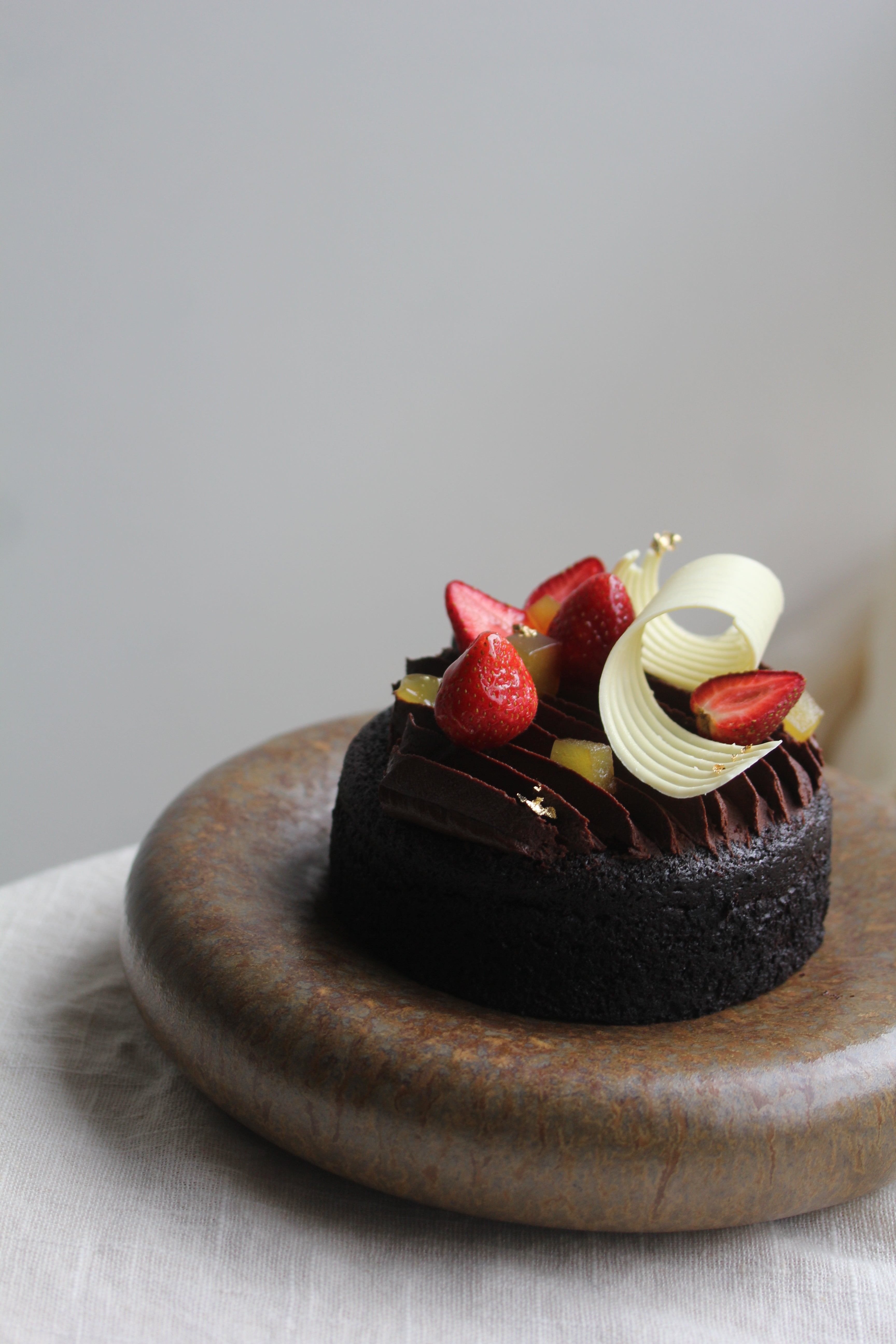 Chocolate cake with whipped chocolate ganache and strawberries