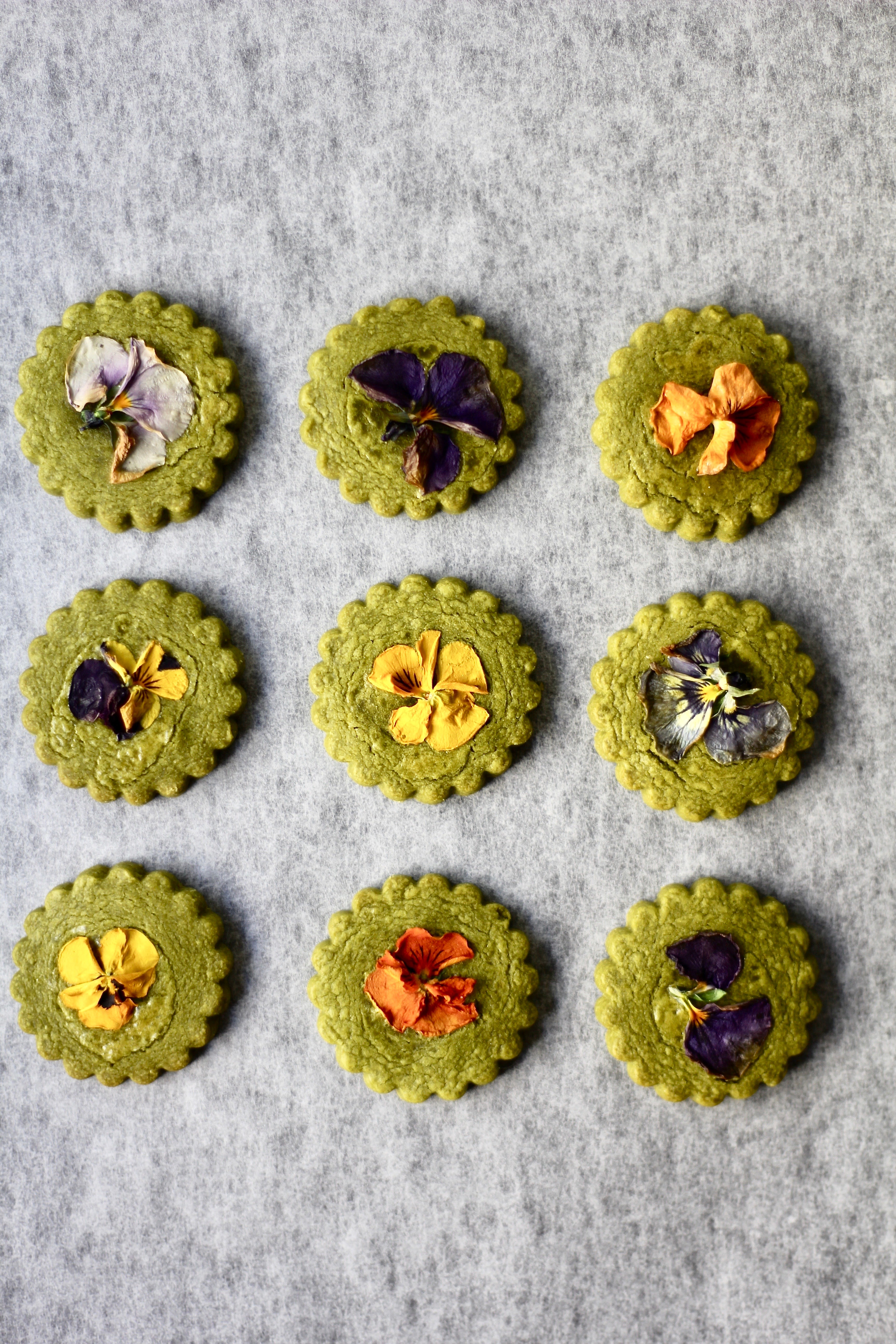 Matcha shortbread cookies with edible flowers